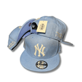 New York Yankees with Cream Embroidered Logo and Script Detail Light Blue Snapback Cap